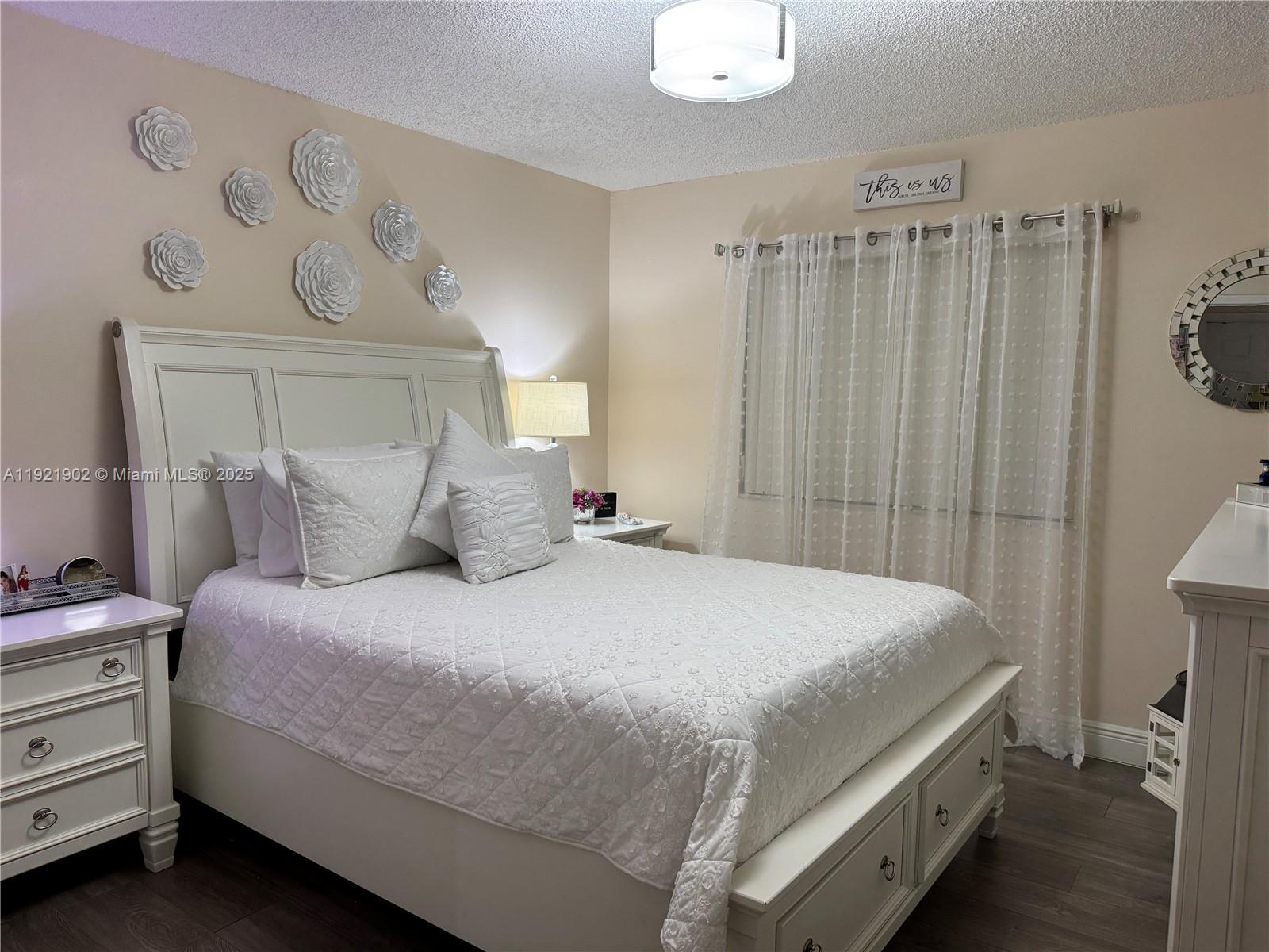 9446 Southwest 140th Court, Unit 9446 Miami, FL 33186 - Photo 10 of 48 a bedroom with a bed and a window