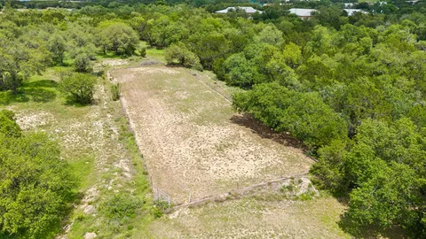 a view of a yard with trees