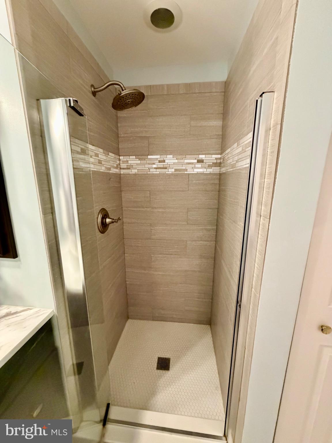 1855 Stratford Park Place, Unit 214 Reston, VA 20190 - Photo 13 of 29 a bathroom with a shower
