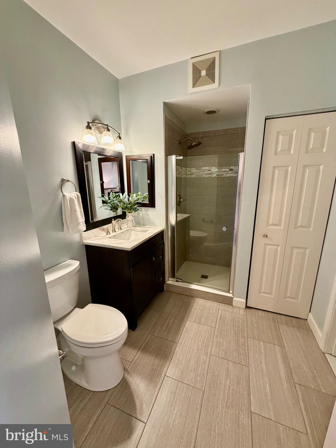 1855 Stratford Park Place, Unit 214 Reston, VA 20190 - Photo 16 of 29 a bathroom with a sink toilet and shower