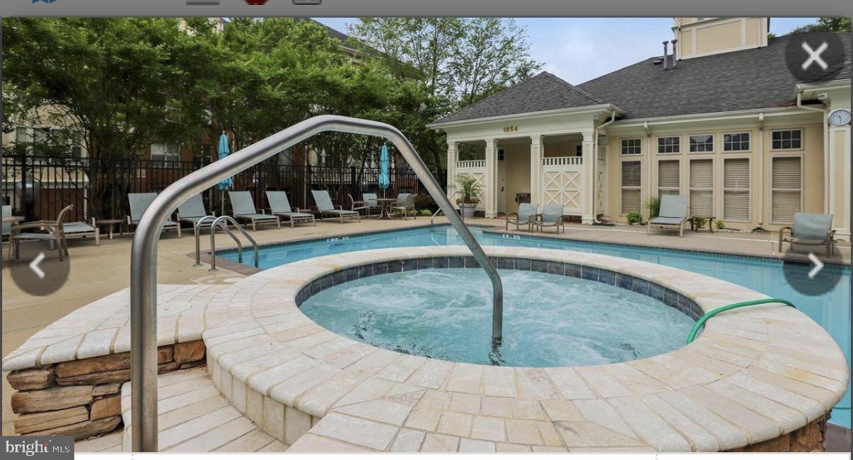 1855 Stratford Park Place, Unit 214 Reston, VA 20190 - Photo 20 of 29 a view of a house with swimming pool