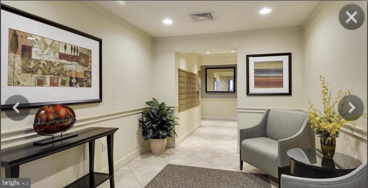 1855 Stratford Park Place, Unit 214 Reston, VA 20190 - Photo 23 of 29 a room with furniture and window