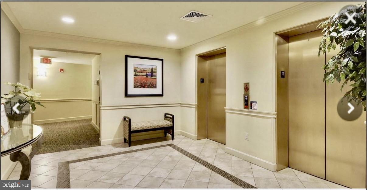 1855 Stratford Park Place, Unit 214 Reston, VA 20190 - Photo 24 of 29 a spacious bathroom with a tub and shower