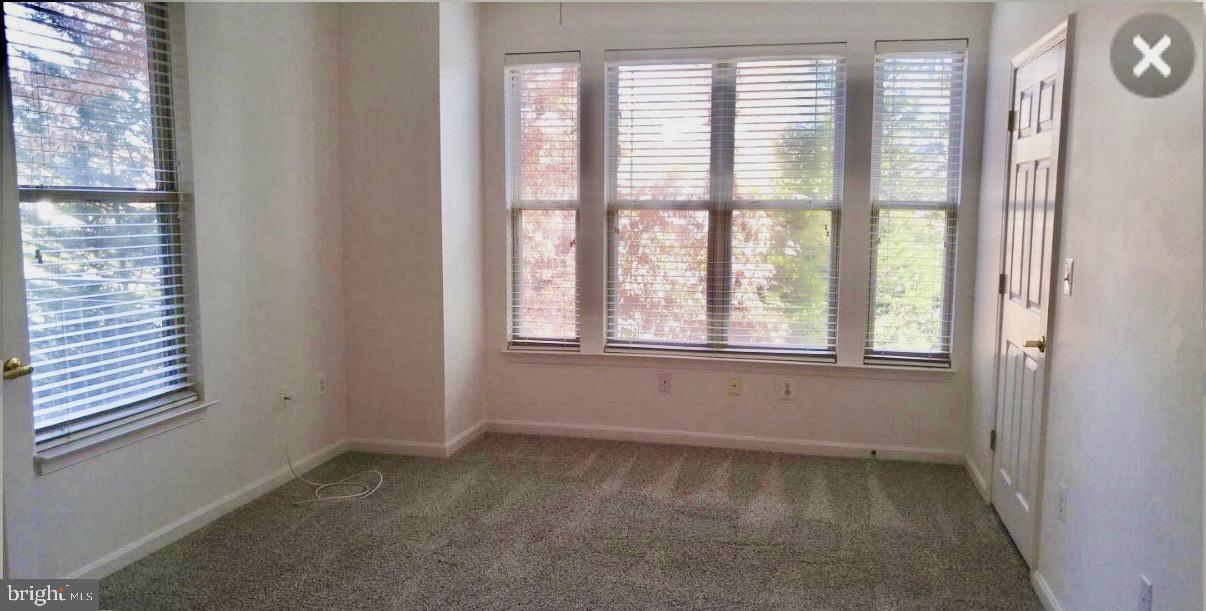 1855 Stratford Park Place, Unit 214 Reston, VA 20190 - Photo 29 of 29 a view of an empty room with a window