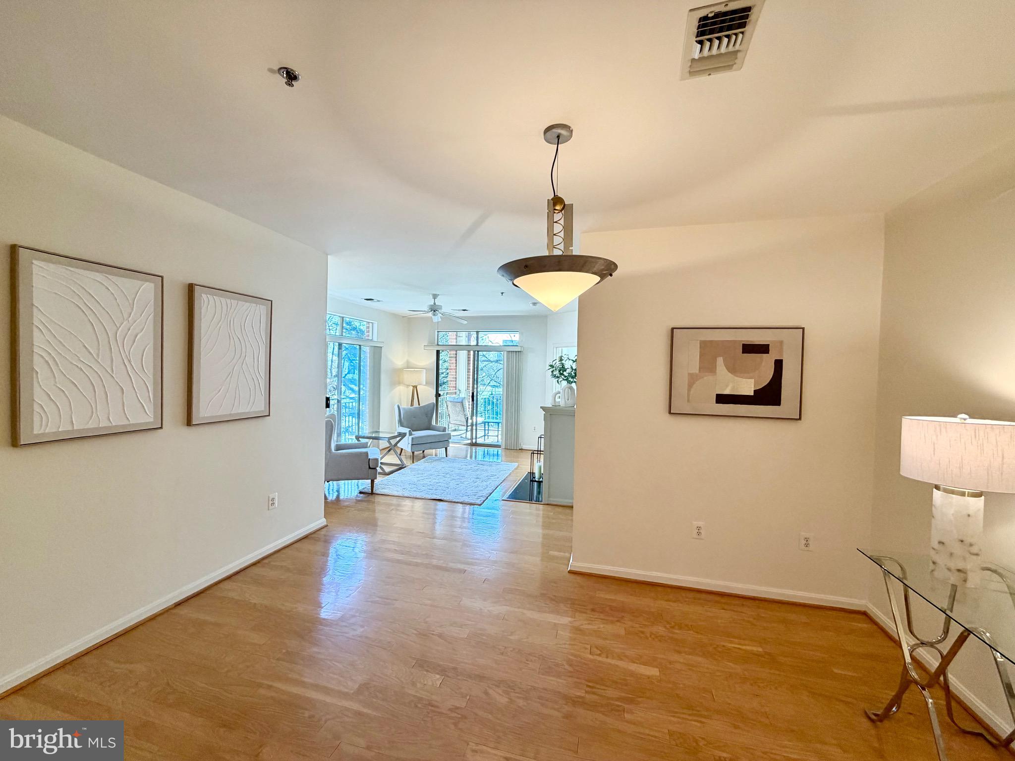 1855 Stratford Park Place, Unit 214 Reston, VA 20190 - Photo 5 of 29 a view of a livingroom with furniture and a window