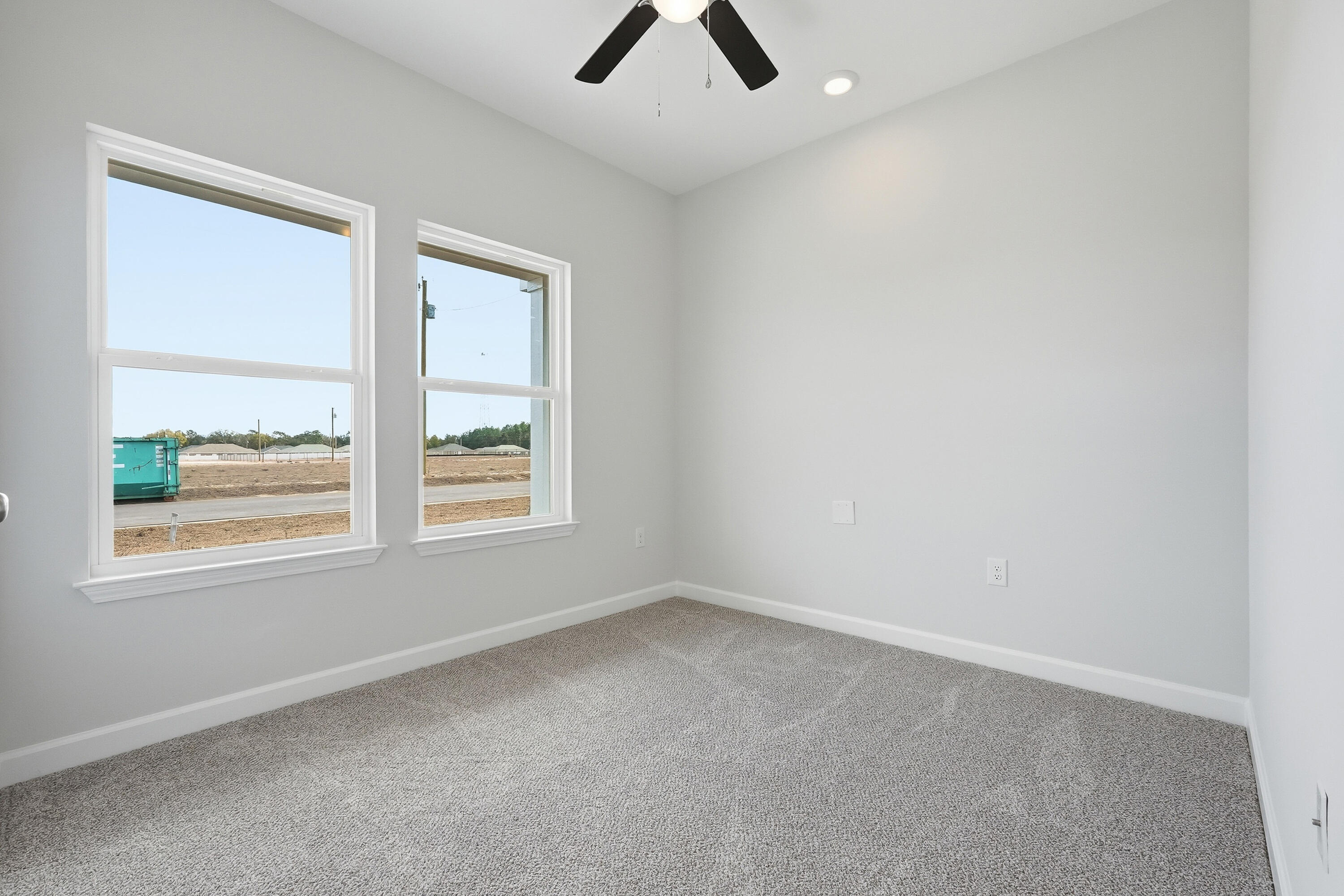 6108 Mildred's Way Crestview, FL 32539 - Photo 18 of 27 an empty room with a window and a ceiling fan