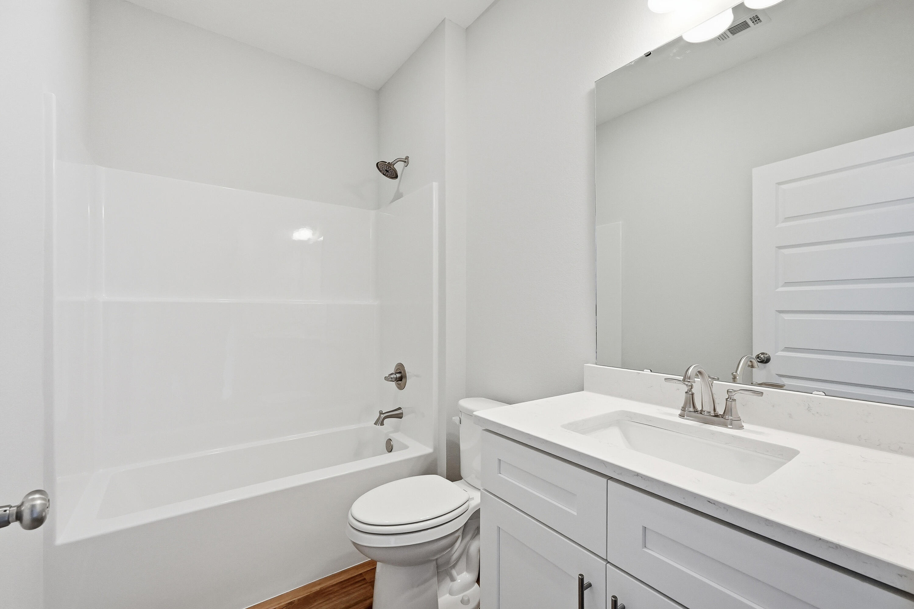 6108 Mildred's Way Crestview, FL 32539 - Photo 19 of 27 a bathroom with a sink toilet a bathtub and shower