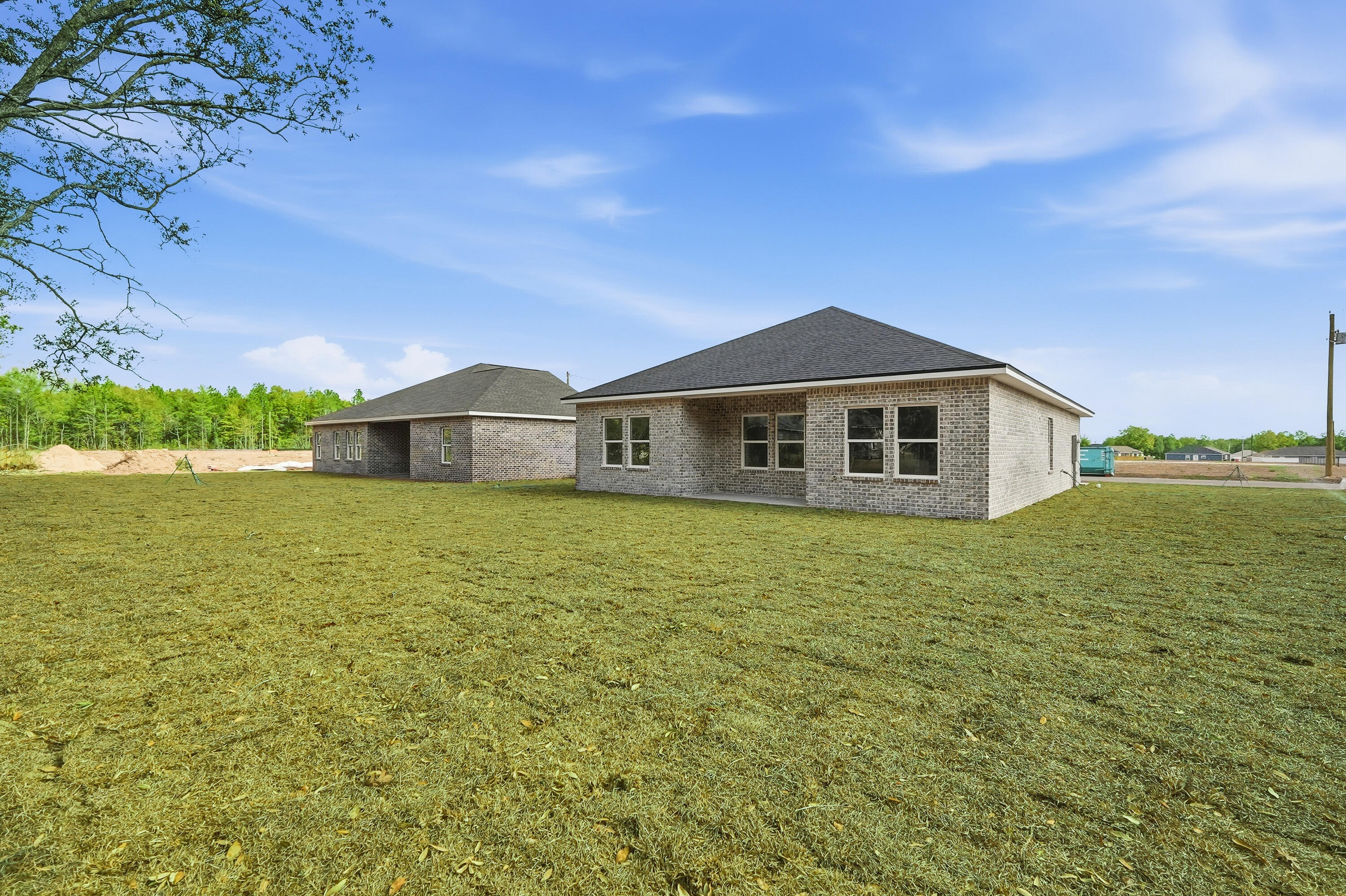 6108 Mildred's Way Crestview, FL 32539 - Photo 23 of 27 a front view of a house with a garden