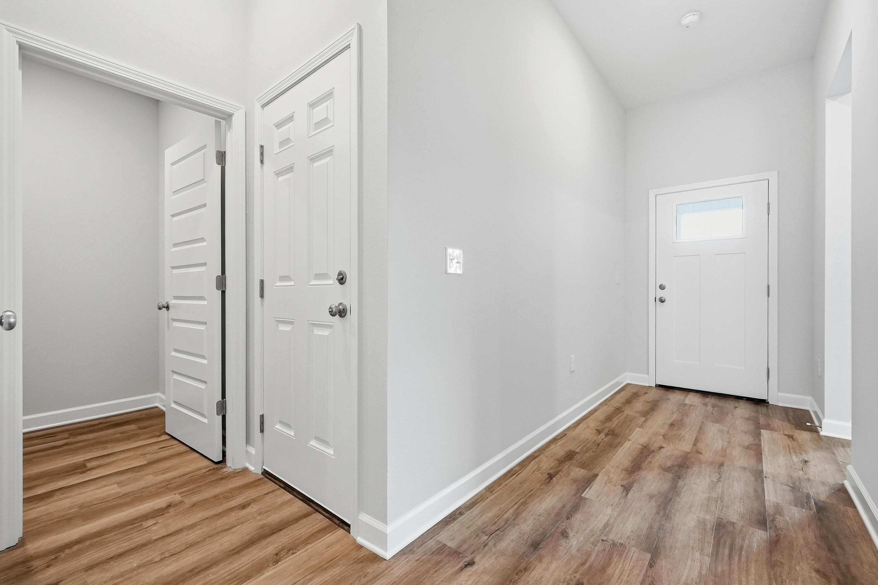 6108 Mildred's Way Crestview, FL 32539 - Photo 3 of 27 a view of a room with wooden floor