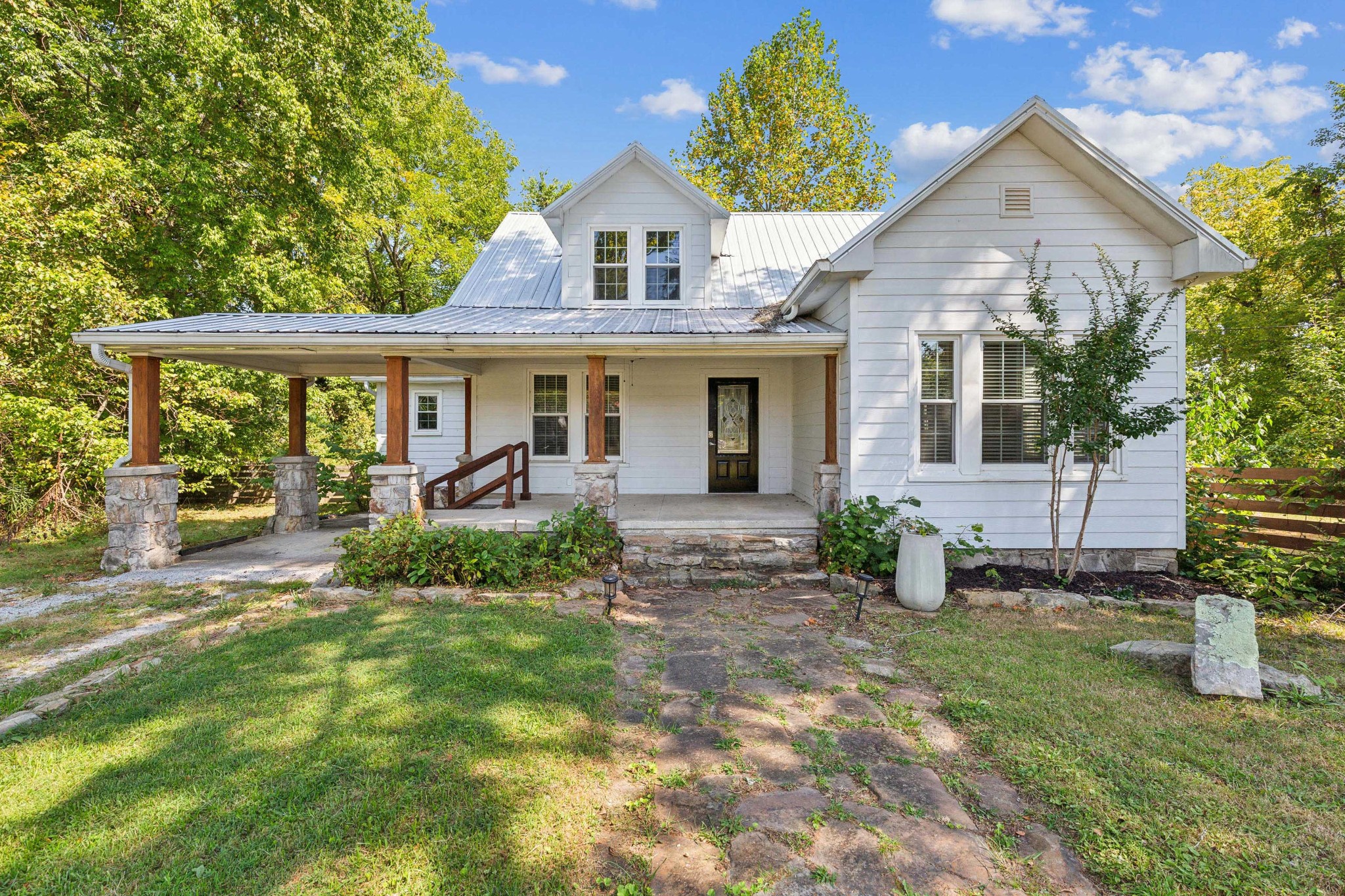 831 3rd Street Tracy City, TN 37387 - Photo 1 of 25 a front view of a house with garden