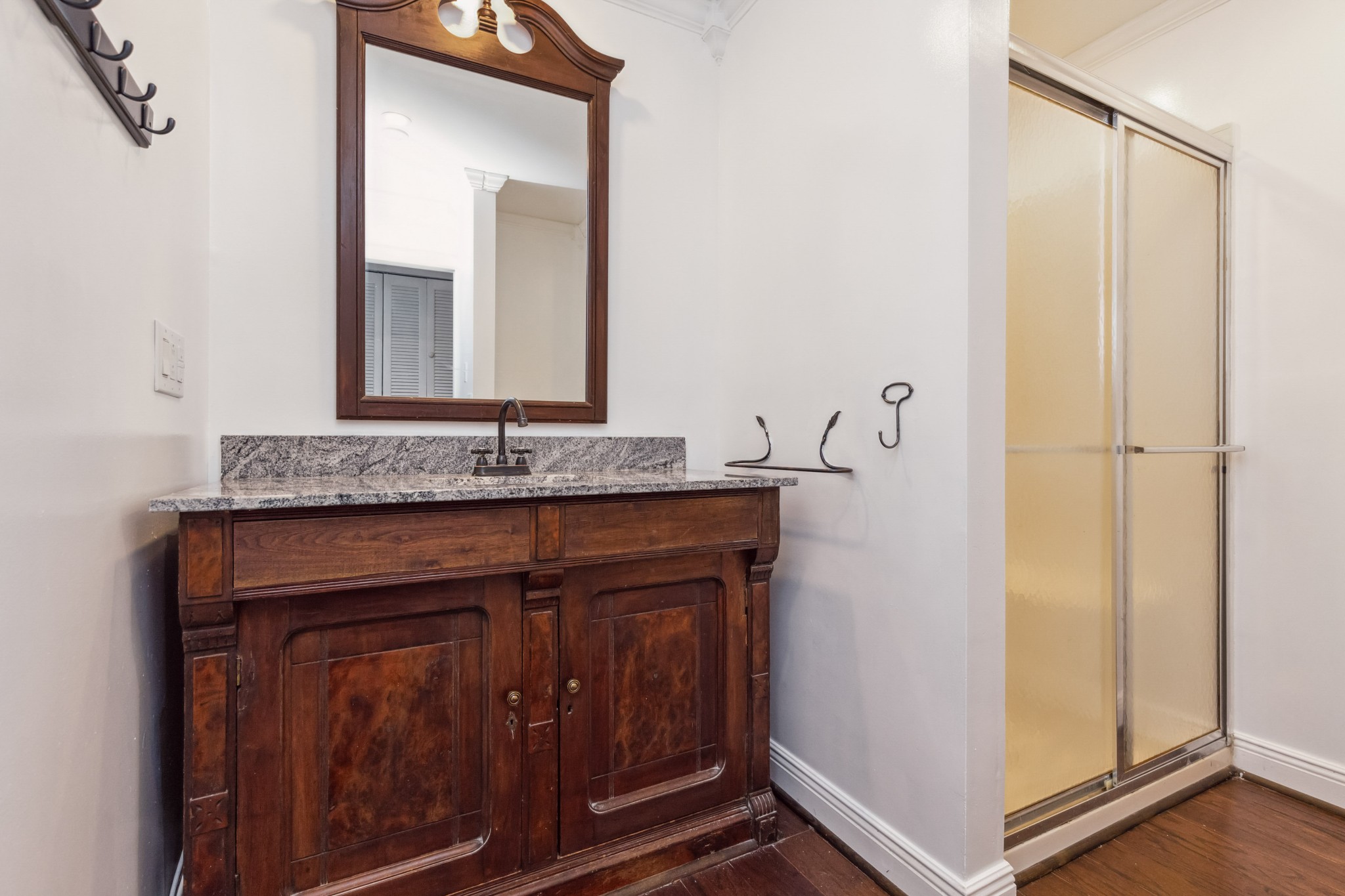 831 3rd Street Tracy City, TN 37387 - Photo 11 of 25 a bathroom with a granite countertop sink and a mirror