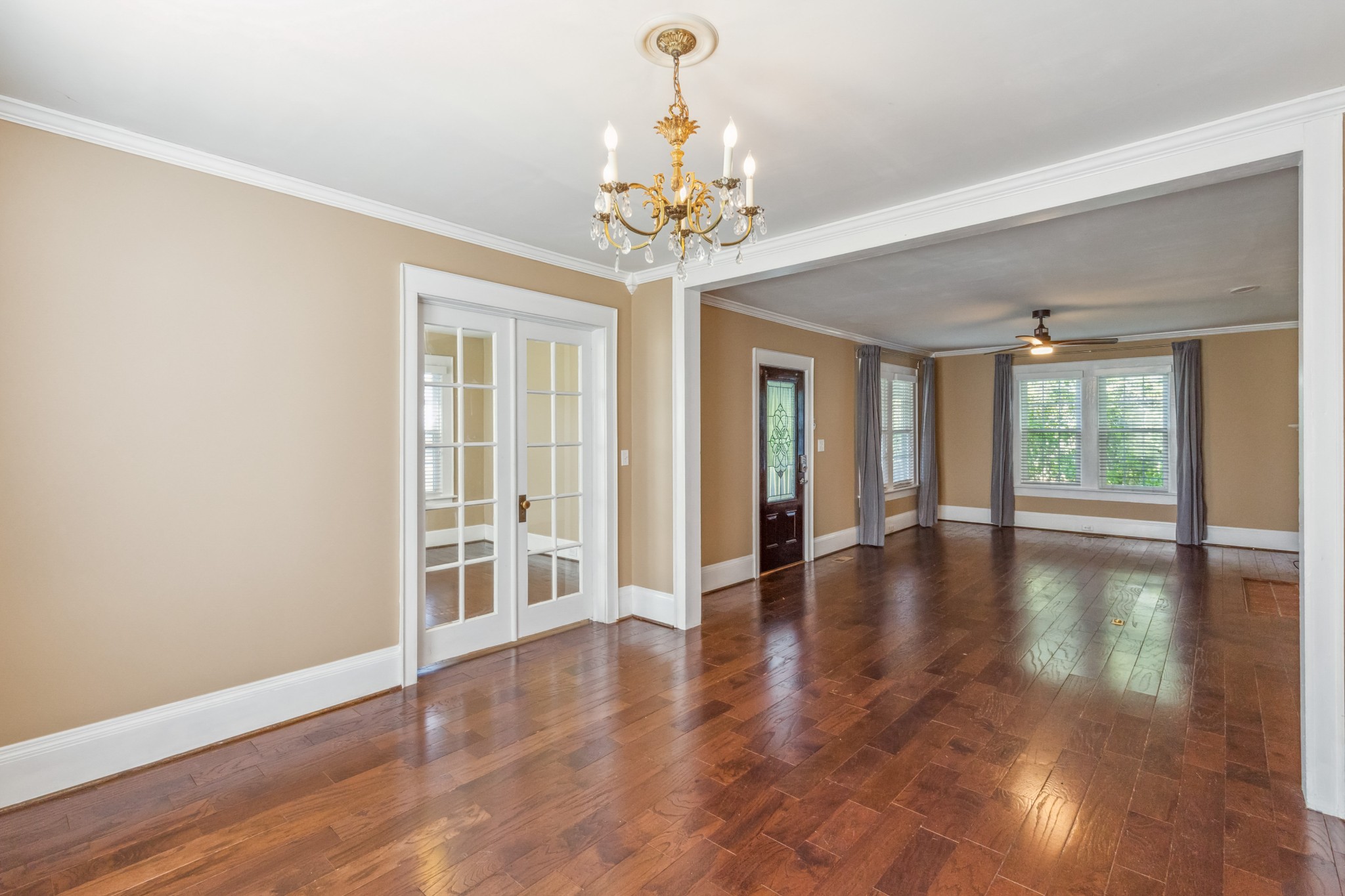831 3rd Street Tracy City, TN 37387 - Photo 3 of 25 a view of an empty room with window and wooden floor