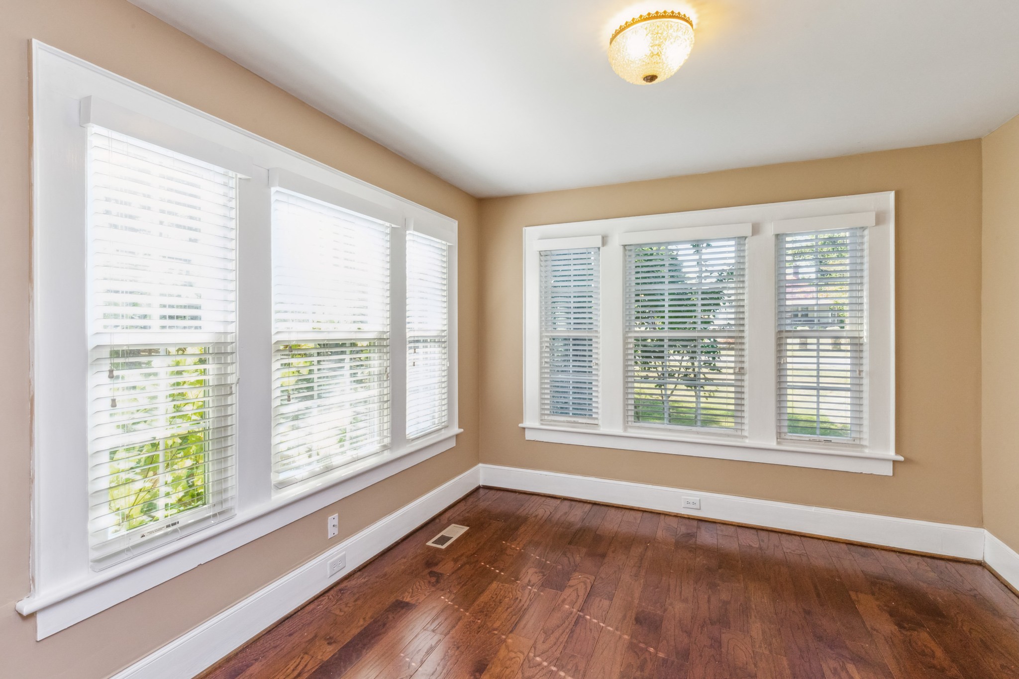 831 3rd Street Tracy City, TN 37387 - Photo 5 of 25 a view of an empty room with a window and wooden floor