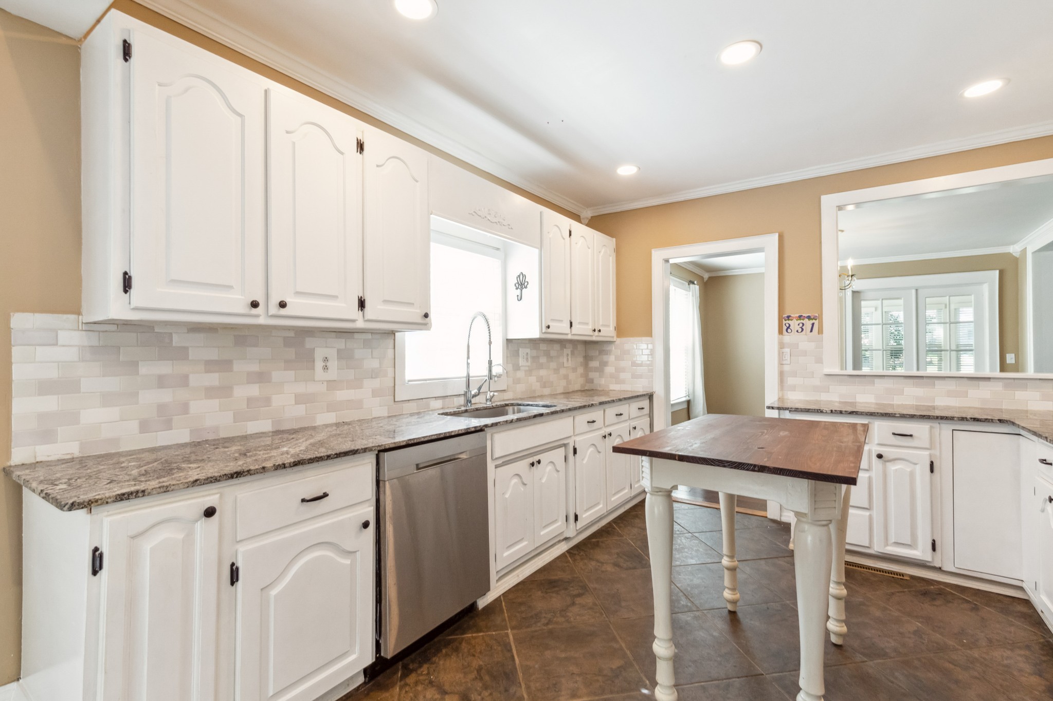 831 3rd Street Tracy City, TN 37387 - Photo 9 of 25 a kitchen with granite countertop white cabinets white appliances and sink