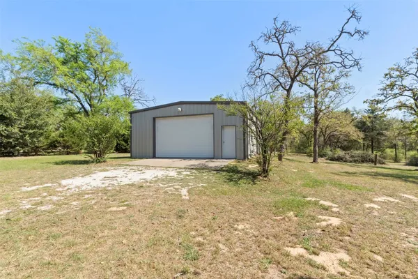 a house with trees in front of it