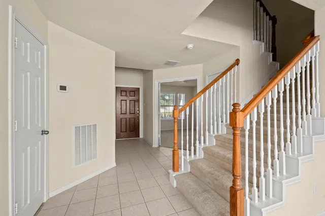 a view of a hallway with staircase