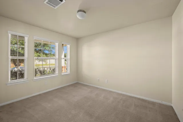 a bathroom with a sink toilet and mirror