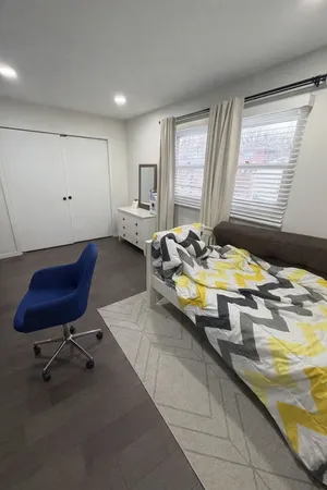 a living room with kitchen island furniture and a window