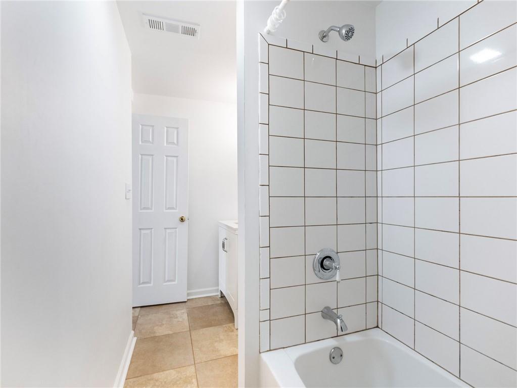 1686 Shoal Creek Road Monroe, GA 30656 - Photo 25 of 50 a bathroom with a bathtub