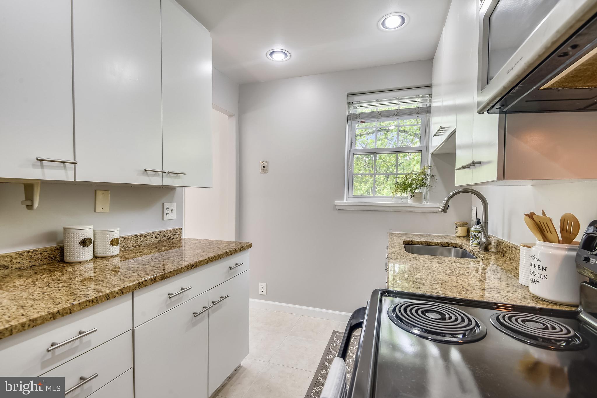 4847 27th Road South Arlington, VA 22206 - Photo 10 of 36 Bright white cabinets w/modern hardware