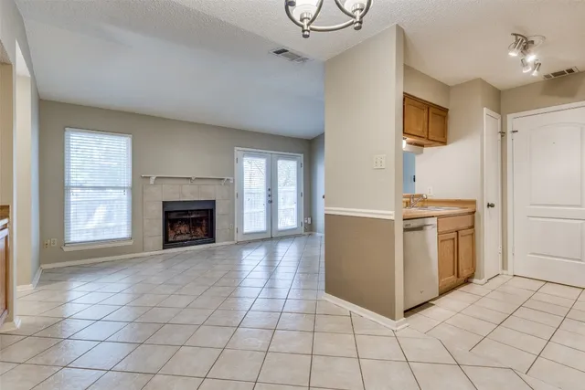 a view of a kitchen with furniture and a fireplace