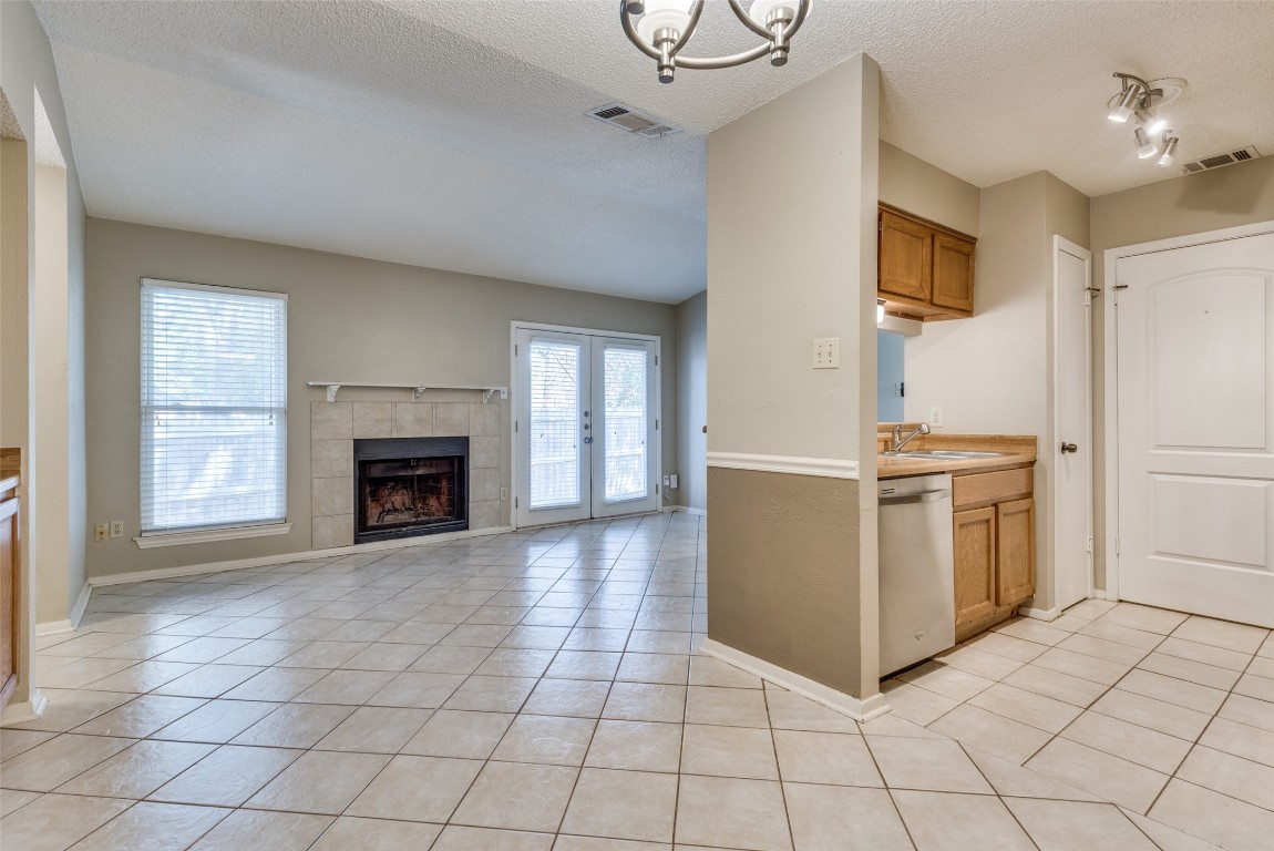 3603 Leafield Drive, Unit A Austin, TX 78749 - Photo 2 of 12 a view of a kitchen with furniture and a fireplace