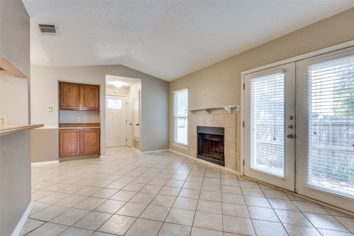 3603 Leafield Drive, Unit A Austin, TX 78749 - Photo 3 of 12 a view of empty room with kitchen and fireplace
