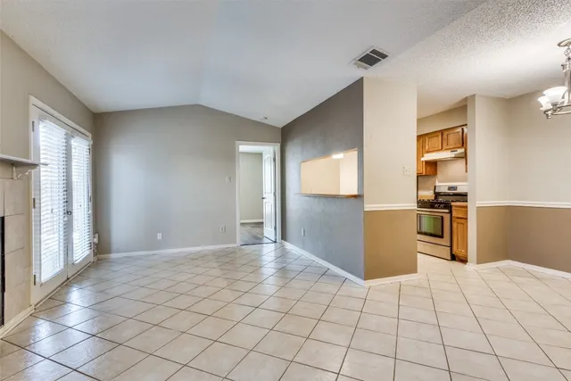 a view of a kitchen cabinets and empty room