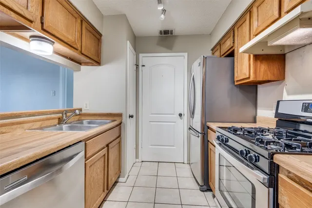 a kitchen with a stove and a sink