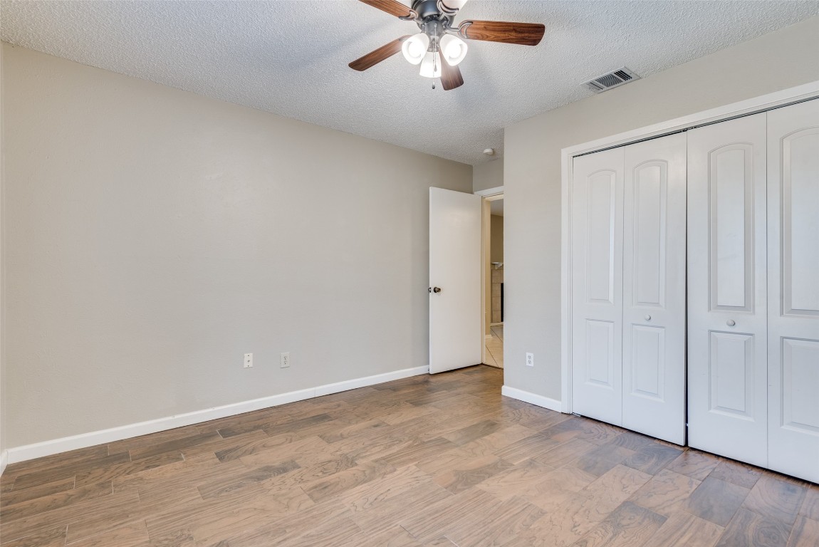 3603 Leafield Drive, Unit A Austin, TX 78749 - Photo 9 of 12 a view of an empty room and chandelier fan