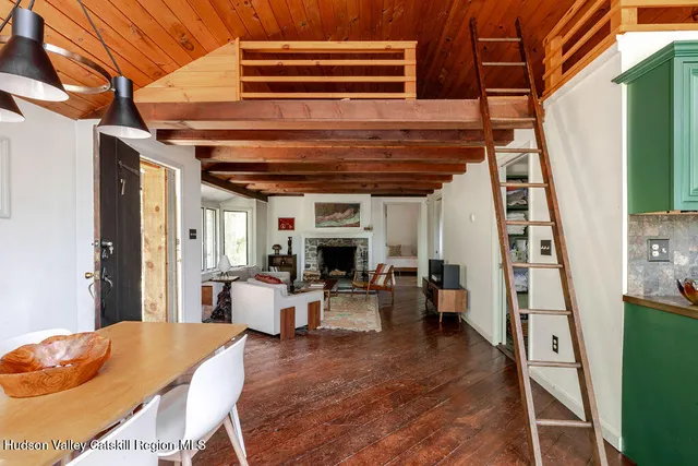 a living room with furniture and fireplace