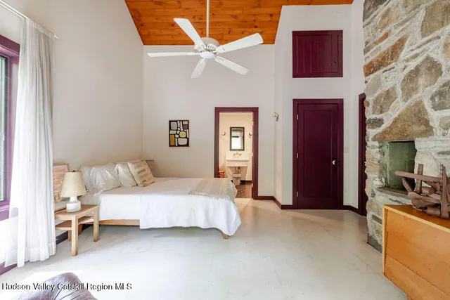 a bedroom with a bed and a couch