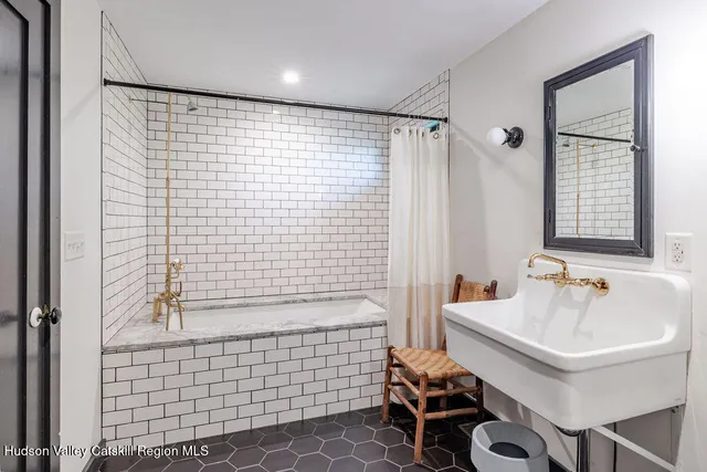 a bathroom with a sink and a shower