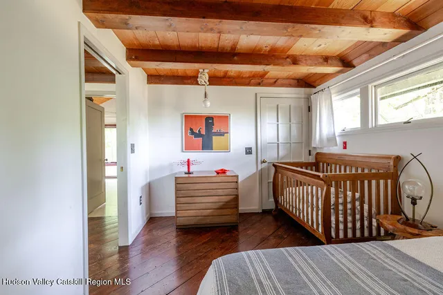 a room with stairs and a wooden floor