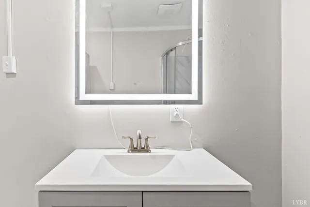 a bathroom with a sink and a mirror