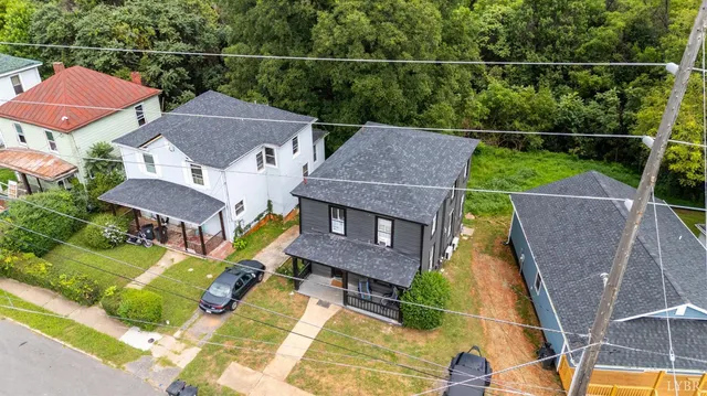 a aerial view of a house with a yard