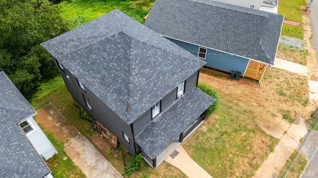 a aerial view of a house with swimming pool