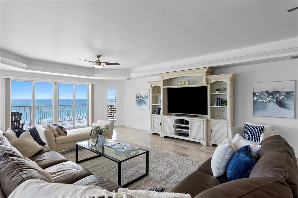 19730 Gulf Boulevard, Unit 400 Indian Rocks Beach, FL 33785 - Photo 8 of 90 a living room with furniture and a flat screen tv