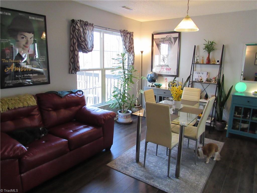 1819 Ebert Road Winston-Salem, NC 27103 - Photo 11 of 29 Laminate flooring in the dining area