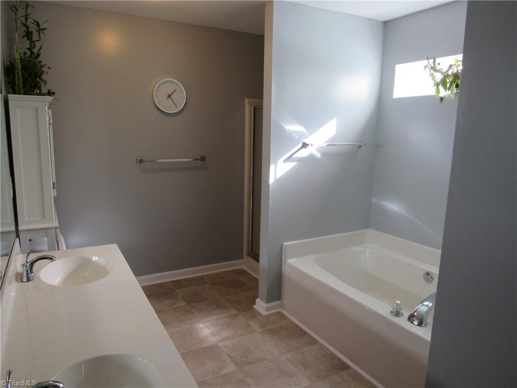 1819 Ebert Road Winston-Salem, NC 27103 - Photo 22 of 29 Master Bath has double sinks and a cultured marble vanity top