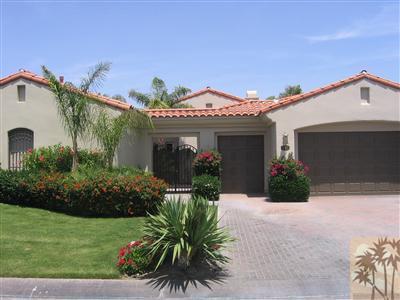 245 Loch Lomond Road Rancho Mirage, CA 92270 - Photo 3 of 21 a view of a house with a yard and potted plants