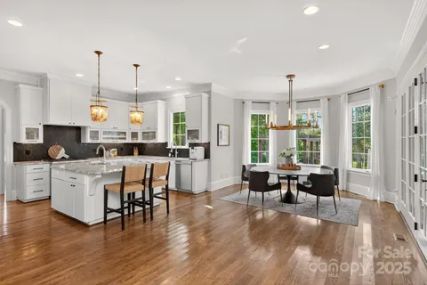a dining room with furniture window wooden floor