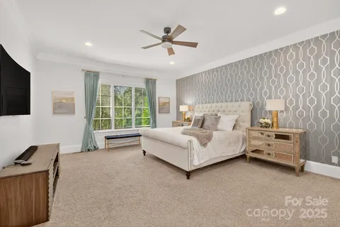 a bedroom with a bed and a couch