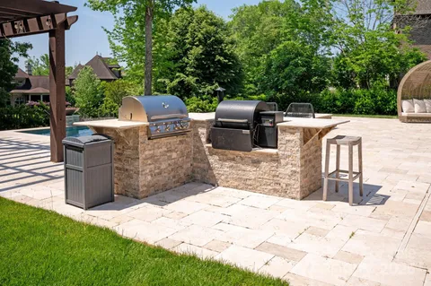 a view of a house with a big yard and potted plants