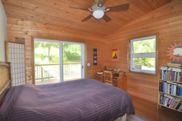 7158 Kahuna Road, Unit 1 & 2 Kapaa, HI 96746 - Photo 17 of 23 a bedroom with a large bed and a window