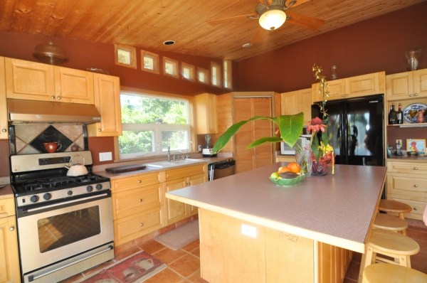7158 Kahuna Road, Unit 1 & 2 Kapaa, HI 96746 - Photo 6 of 23 a kitchen with stainless steel appliances granite countertop a sink and a stove