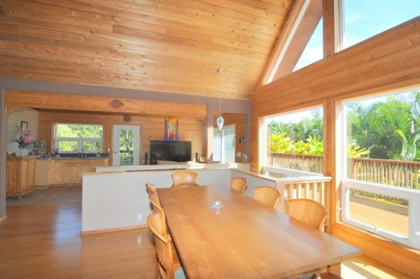 7158 Kahuna Road, Unit 1 & 2 Kapaa, HI 96746 - Photo 7 of 23 a living room with furniture a large window with kitchen view