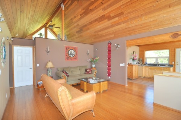 7158 Kahuna Road, Unit 1 & 2 Kapaa, HI 96746 - Photo 9 of 23 a view of a livingroom with furniture and wooden floor
