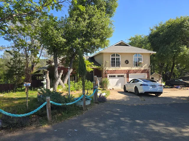 a view of a parked cars in front of house
