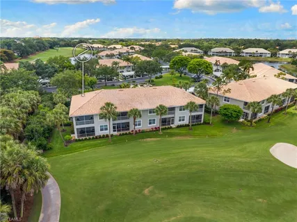 an aerial view of a house with yard swimming pool and outdoor seating